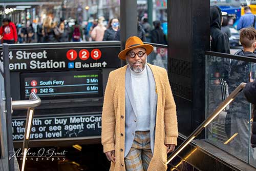 photo of Attorney Royce Russell walking out a a New York City subway station.